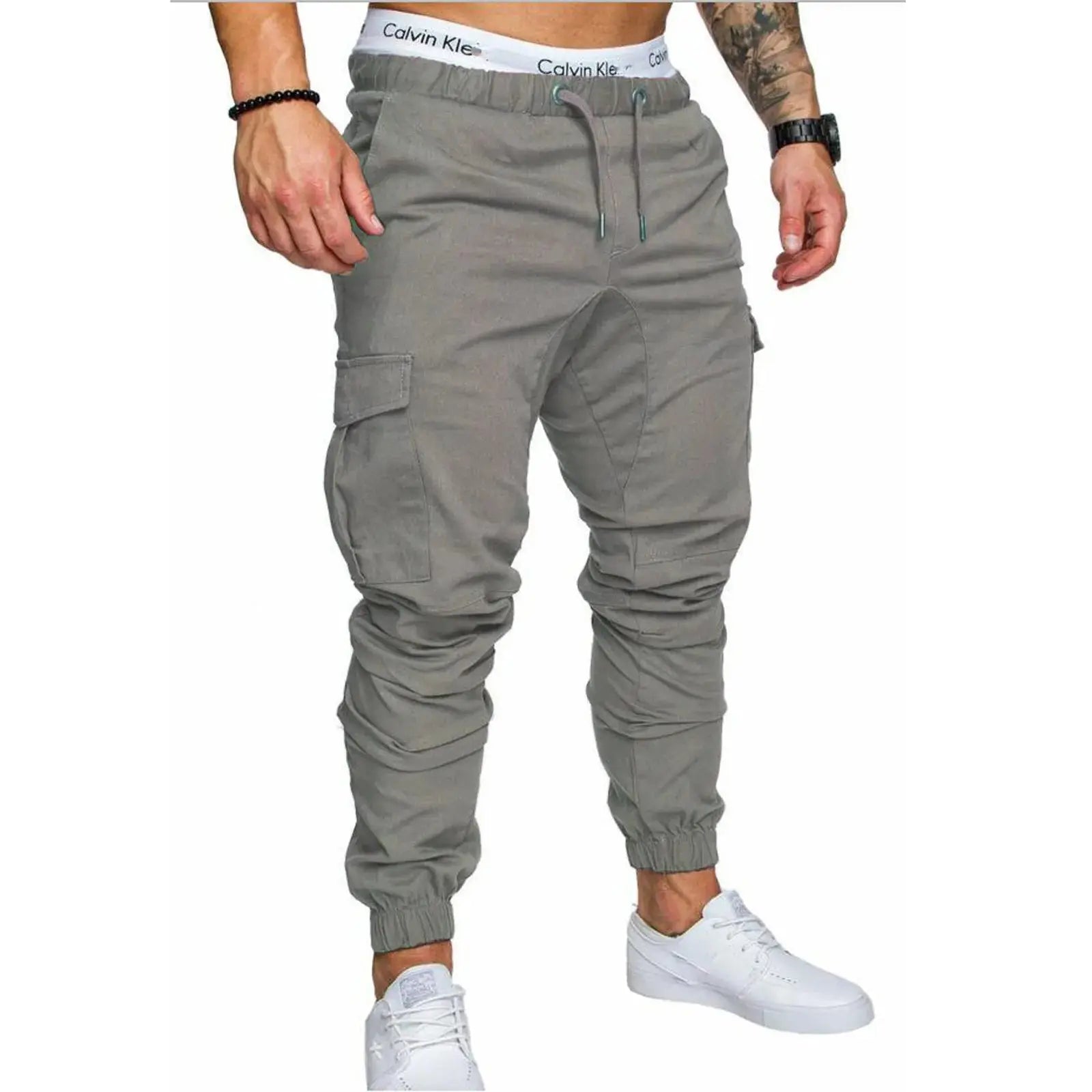 Gray men’s ankle-tied skinny cargo pants with drawstring and multi-pocket design, ideal for spring and summer casual outfits.