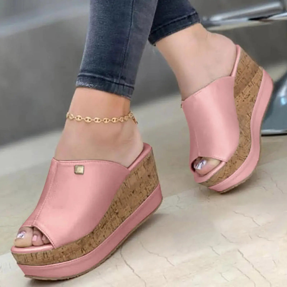 Close-up of pink Roman-style wedge sandals with cork platform, ideal for women’s summer casual and elegant wear.
