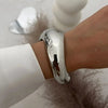 Silver vintage wide bracelet on wrist