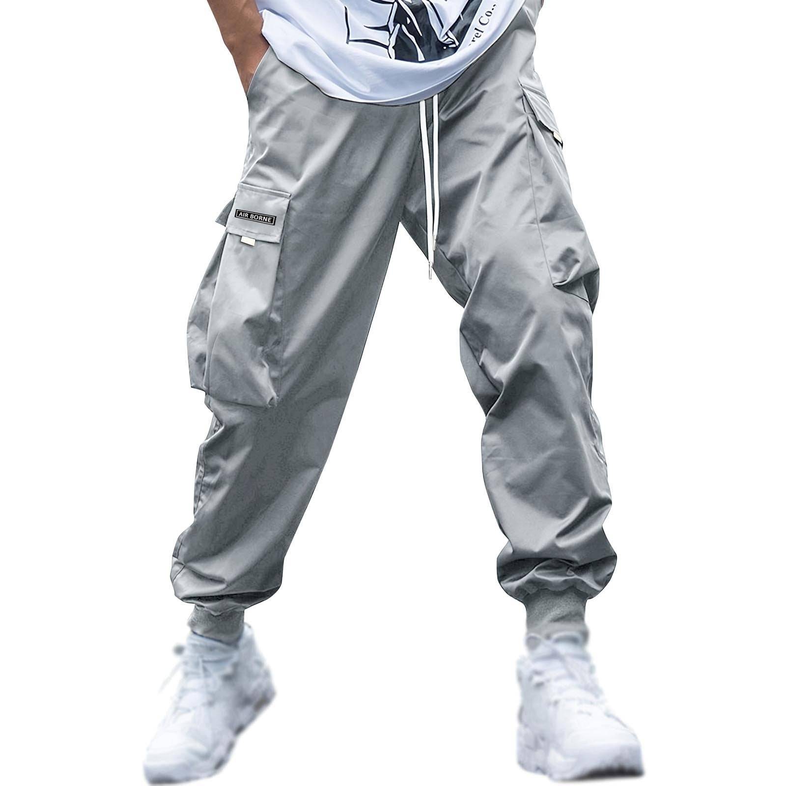 Silver-gray men’s cargo jogger pants with drawstring waist and side pockets, perfect for sporty and casual streetwear looks.
