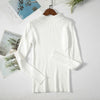 White women's turtleneck sweater on hanger