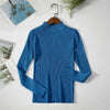 Blue women's turtleneck sweater on hanger