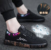 Black graffiti canvas shoes with vibrant accents