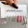 Silver and pink earring set with geometric designs