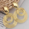 Gold modern round design earrings for women