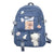 Blue backpack featuring bear and duck patches