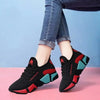 Black women's sneakers with red and teal accents