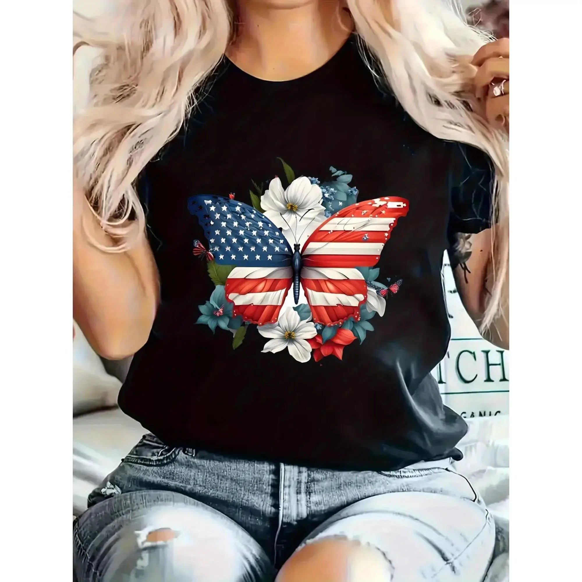 Women’s graphic T-shirt featuring an American flag butterfly and floral print, casual short sleeve black tee for patriotic style.