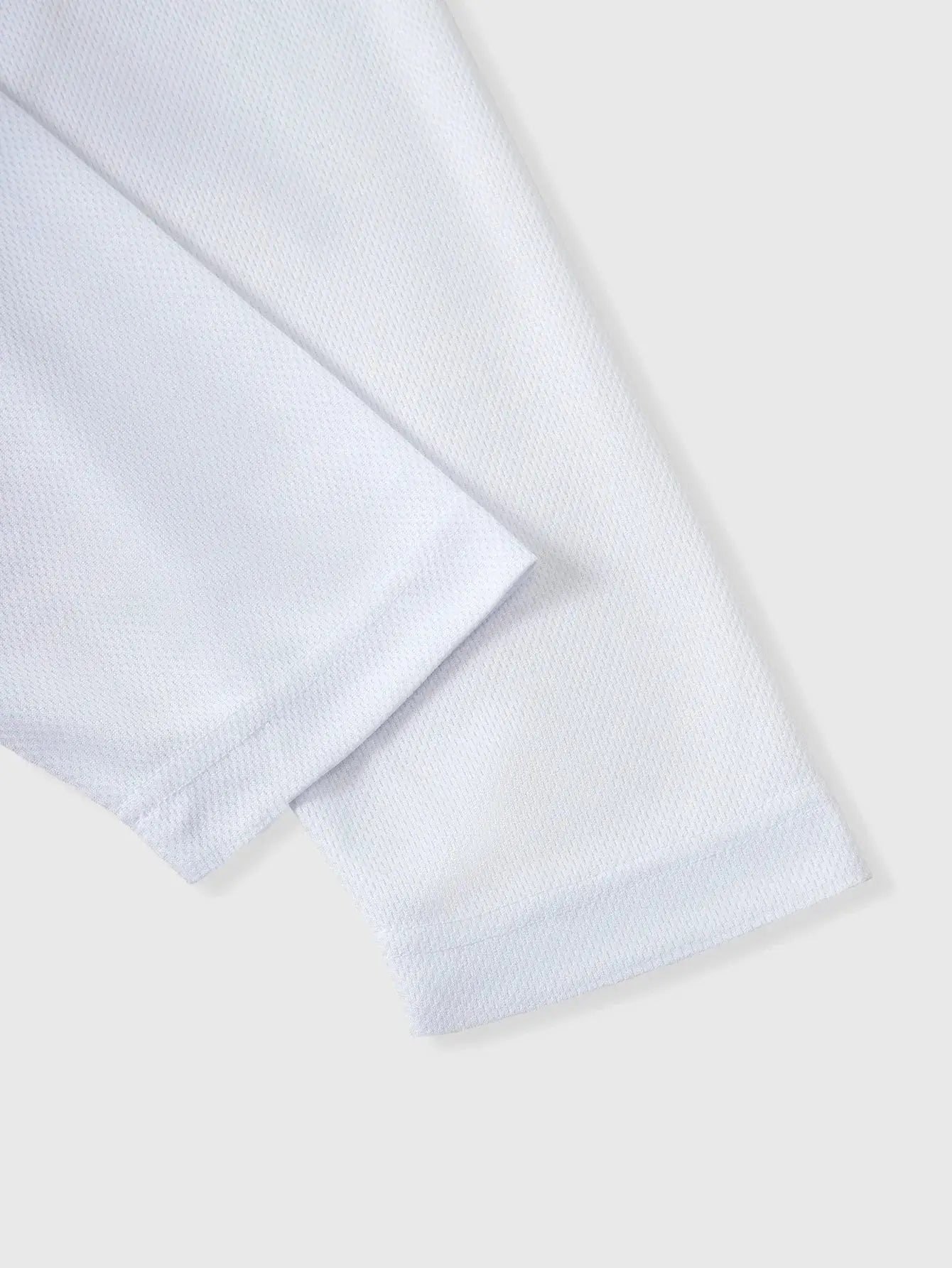 Close-up of white long sleeve breathable mesh fabric from Mens 5-Piece Sportswear Set, ideal for running and fitness activities.