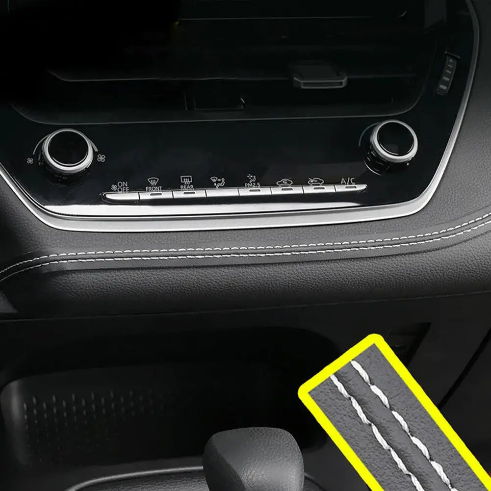 Detailed view of dashboard with white-stitched PU leather trim strip, enhancing vehicle interior with premium look.