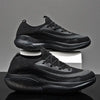 All-black sports shoes for men and women with a sleek, modern design.