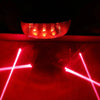 Close-up of red LED bike lights with laser pattern