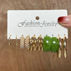 Gold and green earring set with pearls and geometric designs