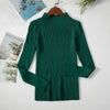 Green women's turtleneck sweater on hanger