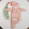 Pink newborn footed jumpsuit with hat