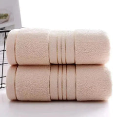 Beige thick cotton absorbent towels, ultra-soft and quick-drying.