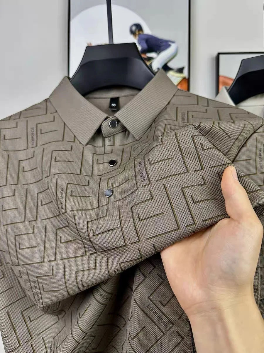 Brown silk t-shirt for men with geometric pattern held close-up.