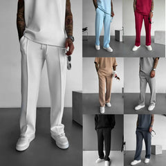 Men's casual pants in multiple colors with elastic waist and drawstring.