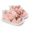 Peach baby shoes with animal print