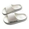 White original slide sandals with black trim