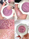 Shimmery pink highlighter compact with swatch