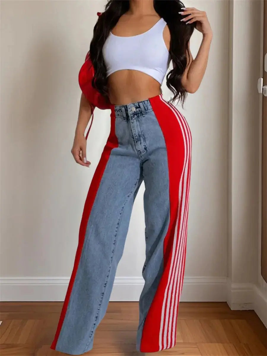 Trendy women’s vintage wide leg jeans in blue denim with bold red side stripes, high waist and relaxed fit for spring fashion looks.