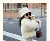 Child in winter coat holding coffee cup