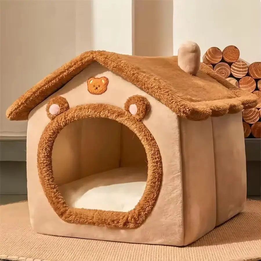 Cave-style foldable pet bed house for indoor use, made of fleece with a bear face design and removable cushion