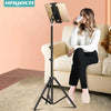 Woman using adjustable tripod floor stand for tablet