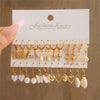 Gold earring set with charms and pearls