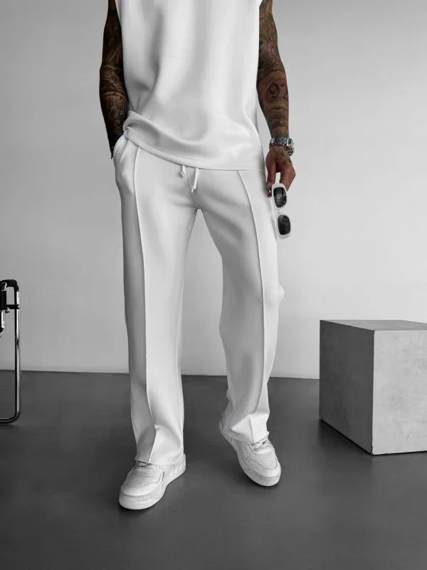 White men's casual pants with elastic waist and adjustable drawstring.