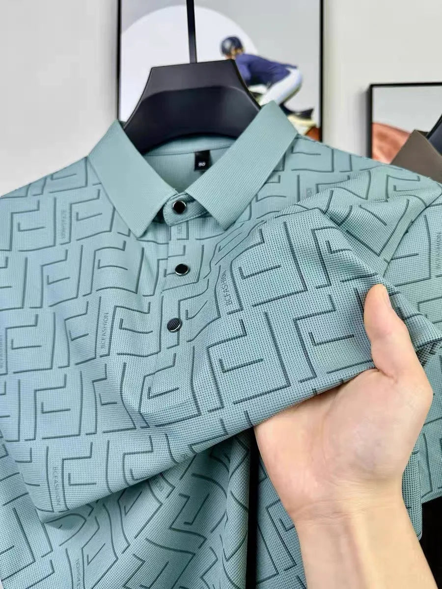 Light green silk t-shirt for men with geometric pattern held close-up.