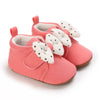 Coral baby shoes with polka dot bows