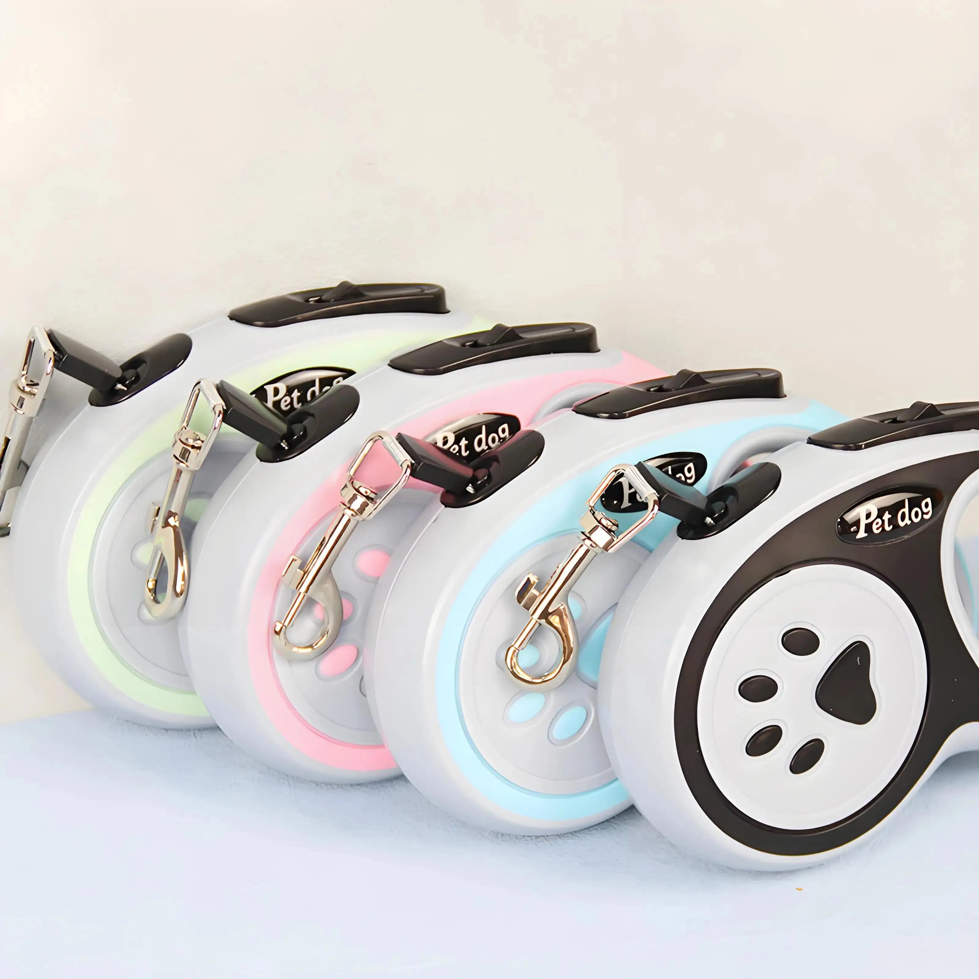 Five Automatic Retractable Nylon Pet Leashes in assorted colors. Durable traction ropes for small dogs and cats, perfect for pet walking and control.