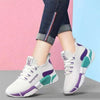 White women's sneakers with purple and teal accents