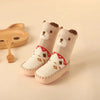 Bear-themed baby shoes with tribal design