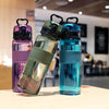 Colorful 500ml sports water bottles on a table