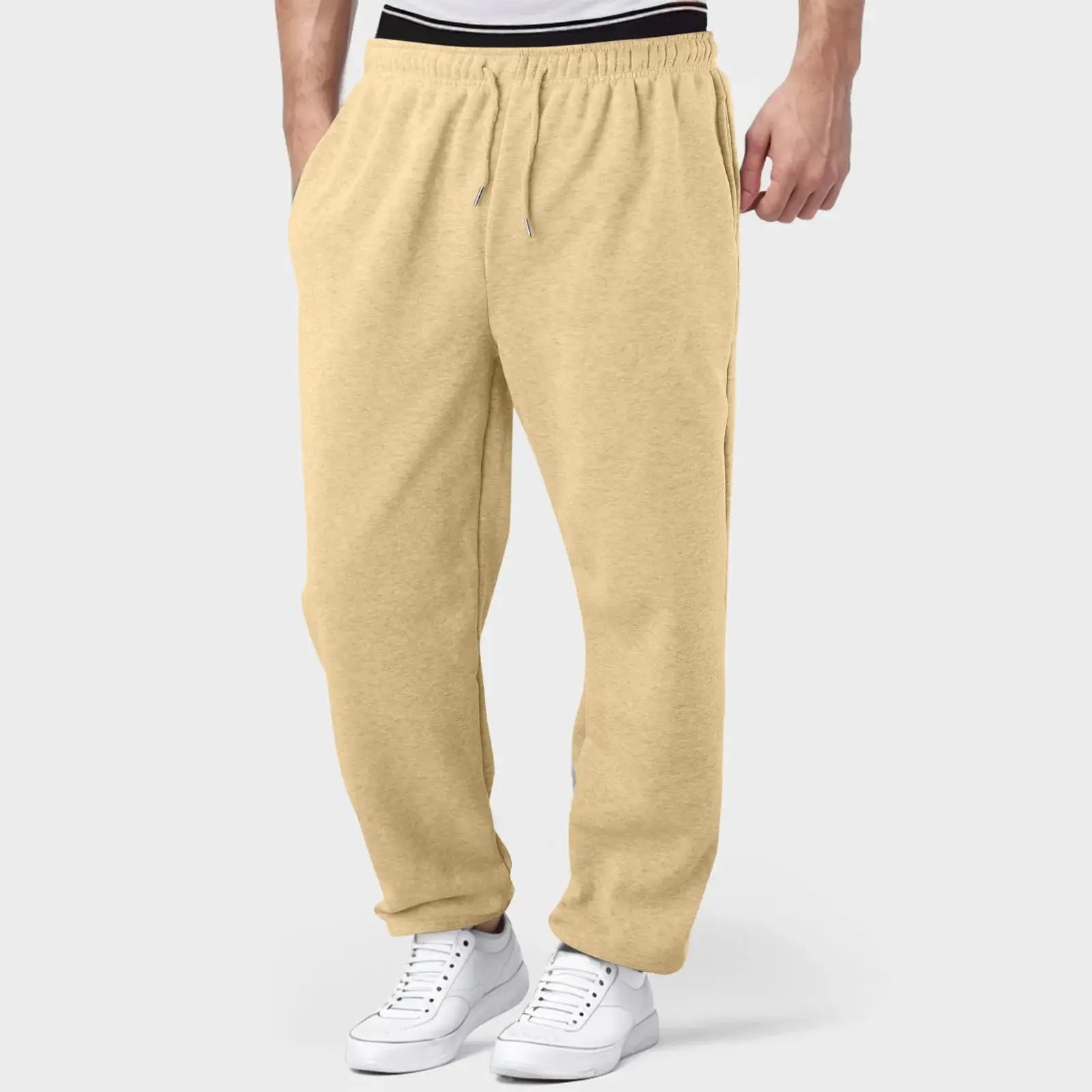 Beige men’s jogger pants with drawstring waist, breathable and lightweight for training, gym, or everyday wear.
