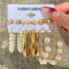 Gold and pearl earring set with geometric designs