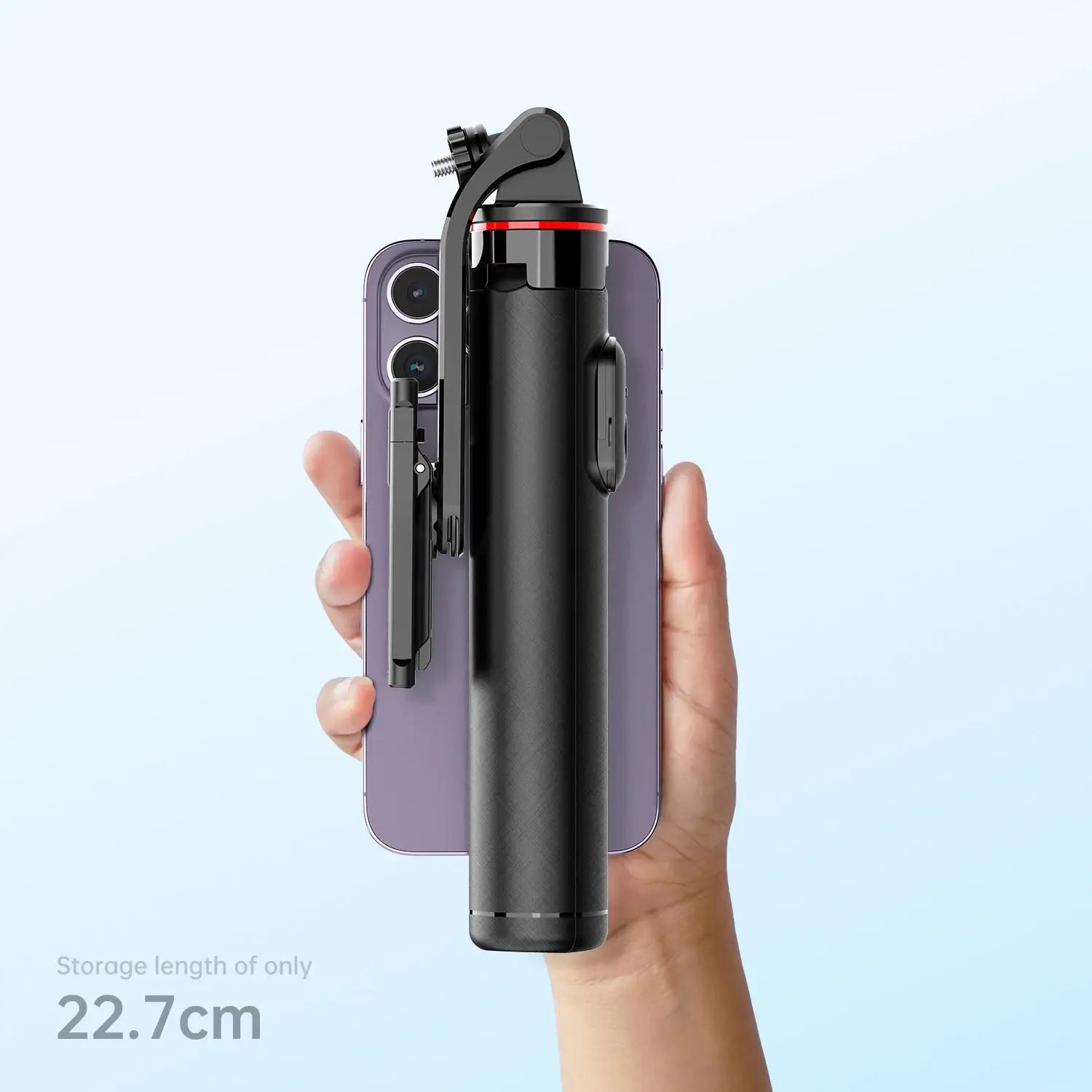 Compact Bluetooth Selfie Stick Tripod folded to 22.7cm for easy portability, shown next to smartphone for size comparison.