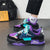 Purple and teal men's sneakers worn with black pants.