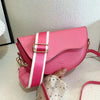 Pink vintage PU leather crossbody bag with striped strap