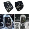 Black gear shift knob panel with white lettering