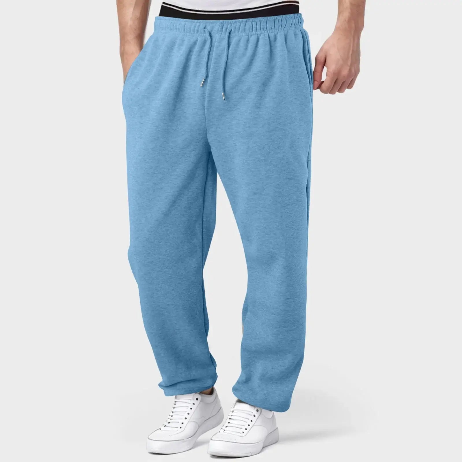Sky blue men’s workout jogger pants with elastic waistband, breathable and perfect for gym, training, or relaxed wear.