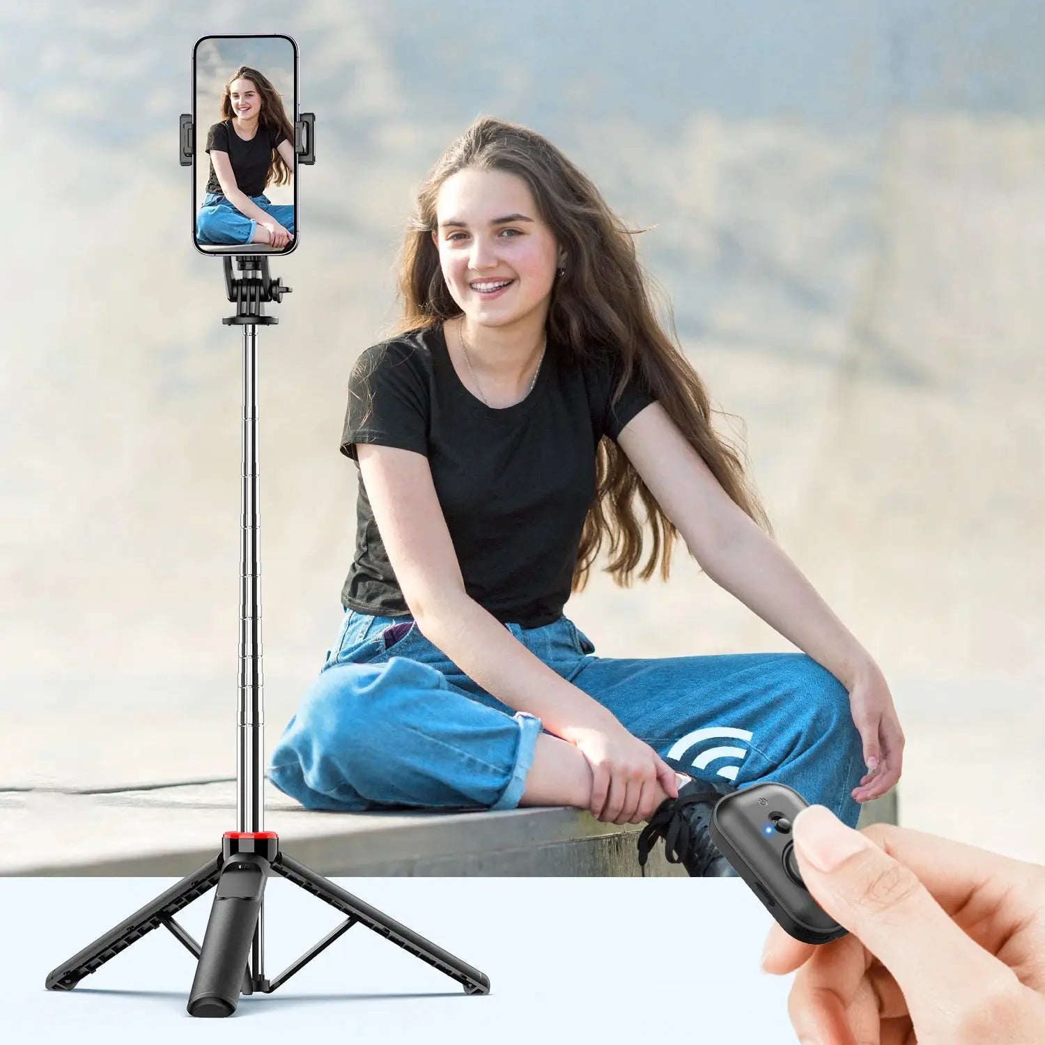 Bluetooth Selfie Stick Tripod with wireless remote control used for hands-free portrait photography, ideal for vlogging and selfies.