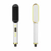 White and gold electric hair straightener brush