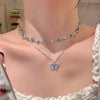 Blue crystal butterfly necklace with layered design