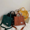 Collection of women's corduroy bags in various colors