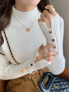 White ribbed women's sweater with button details