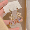 Gold flower earrings with crystal hoops and gems